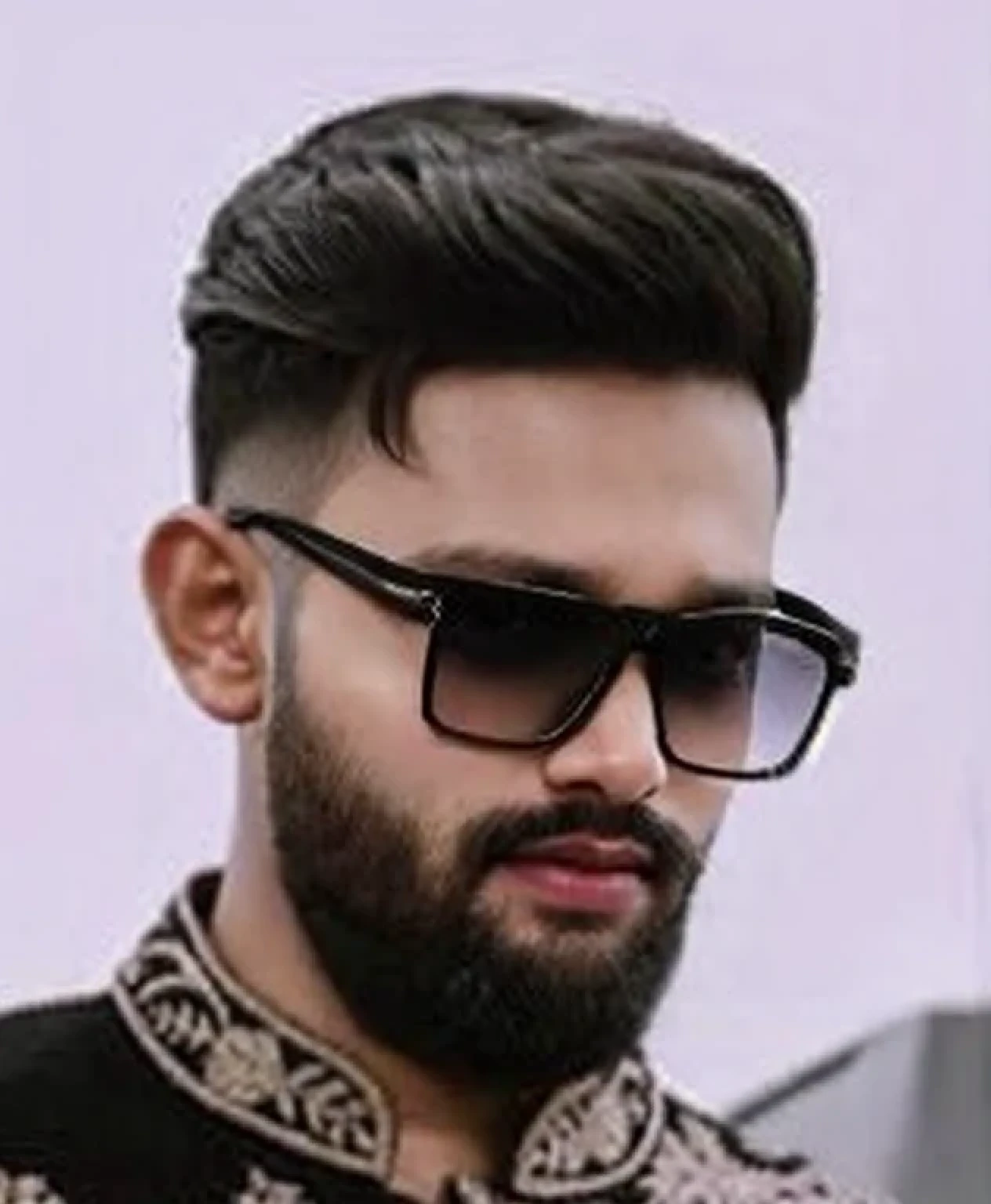 A beautiful young bearded man with highly detailed skin.black hair.happy emotion