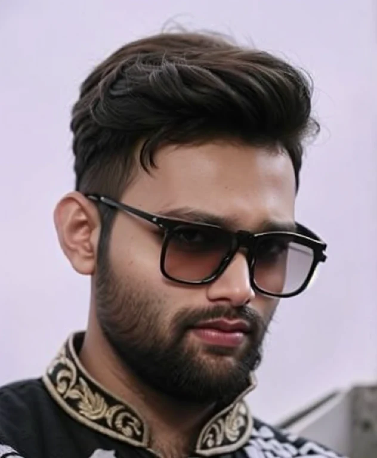 A beautiful young bearded man with highly detailed skin.black hair.happy emotion