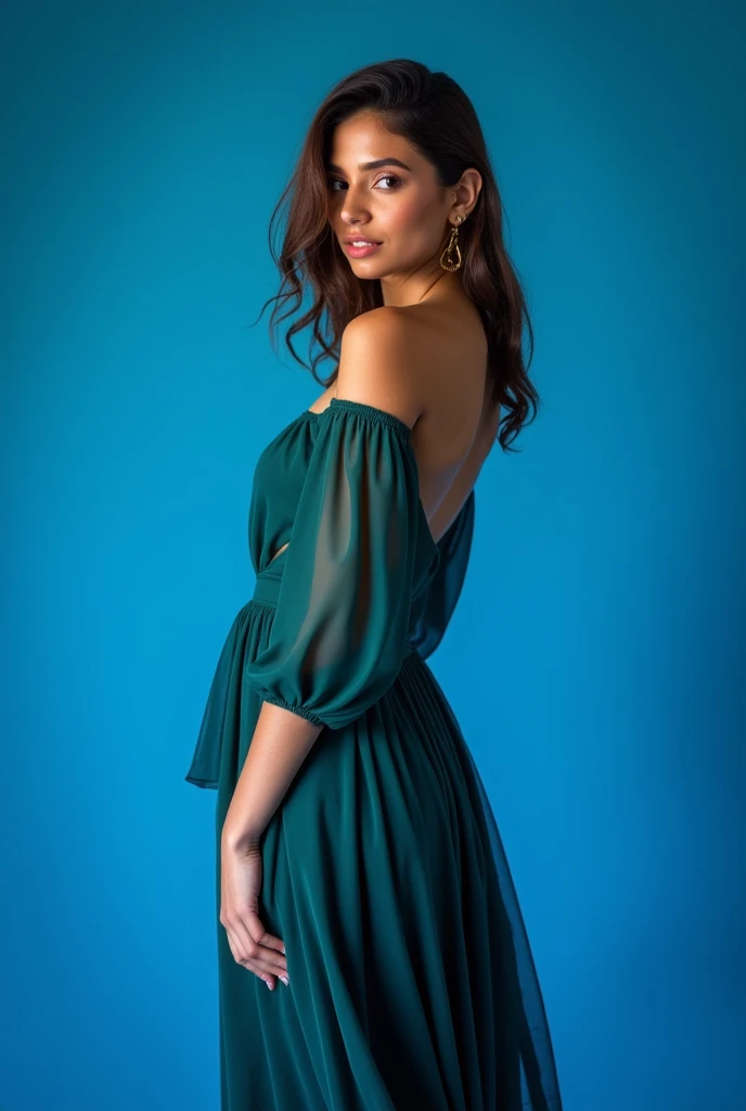 BRAZILIAN PHOTOGRAPHIC MODEL IN STUDIO WITH BLUE BACKGROUND WEARING ELEGANT SLEEVED DRESS