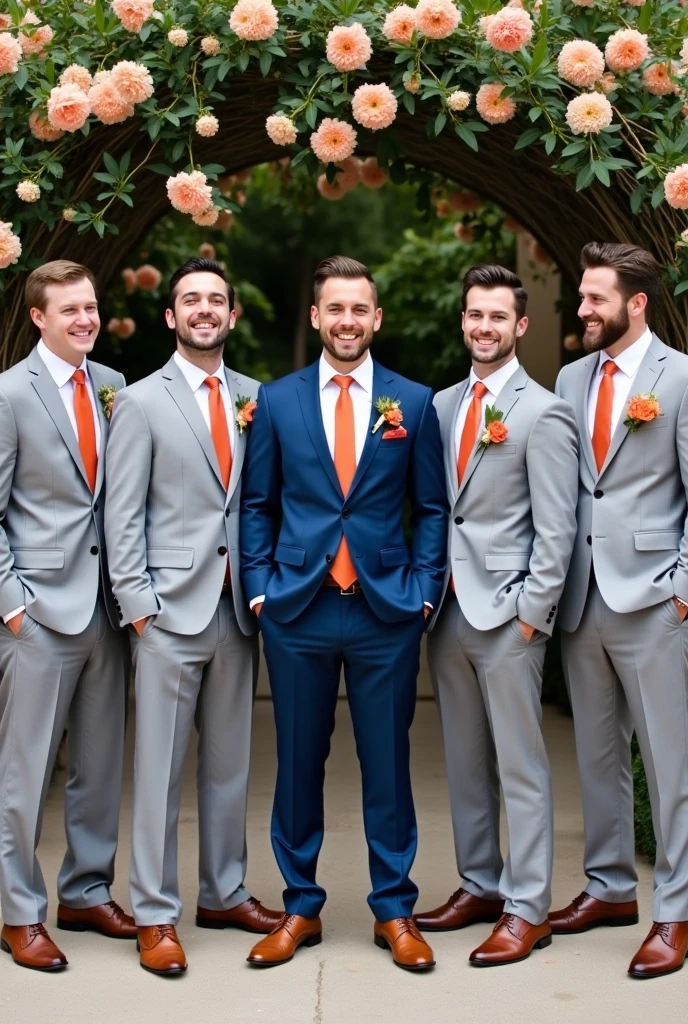 6 groomsmen in light gray suits and terracotta-colored ties and the groom in blue suit in the middle
