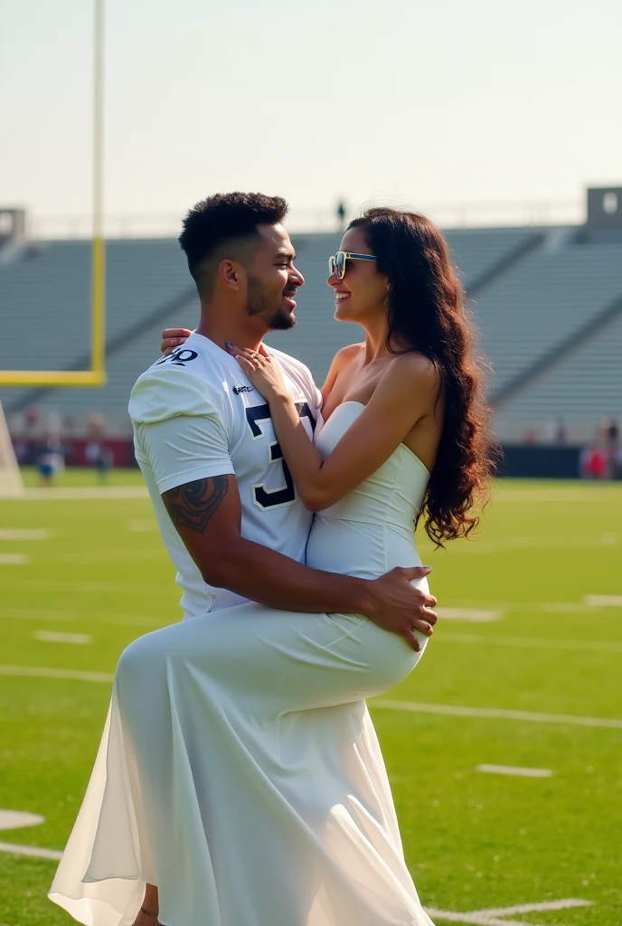 A man and woman standing in a football field . Man in pickup the girl .man wear 32 number white jersey.woman wearing white dress and glasses she has black hair looking at each other boy is not wearing glasses and boy is taller than girl by 1 feet man is carried woman in his arms