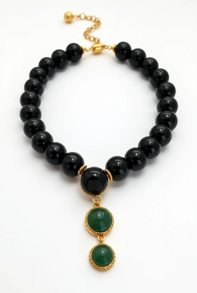 A choker made of black onyx stones with a gold-set, round jade stone as a pendant on a white background