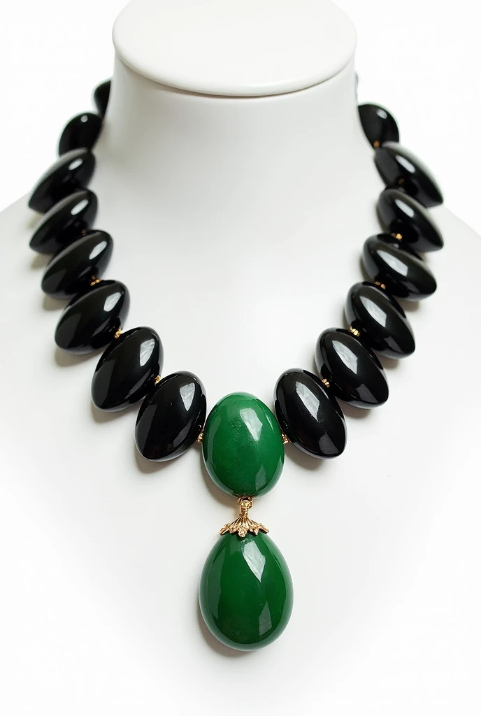 A collar made of black, different sized onyx stones with a gold-set, round jade stone as a pendant on a white background