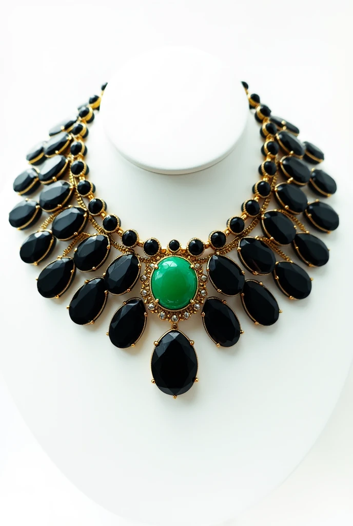 A collar made of black, increasing onyx stones with a completely gold-set, round jade stone as a pendant on a white background