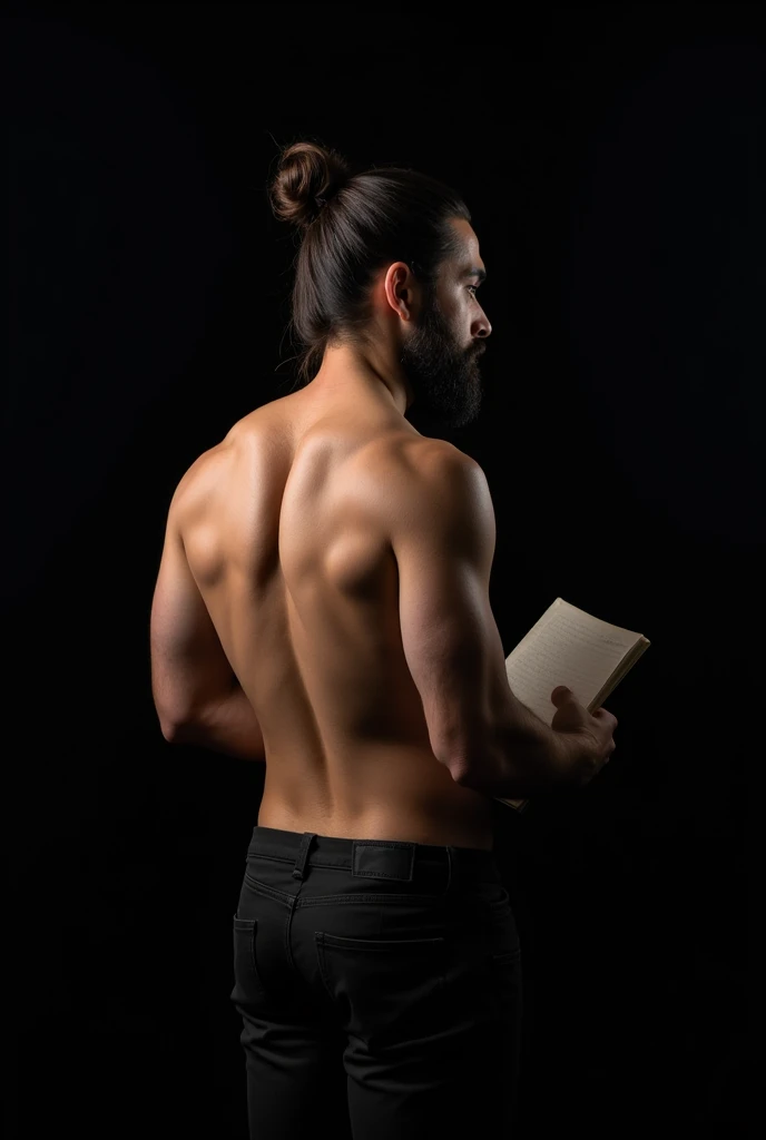 A man is seen from behind. He is turning slightly back. He is looking to the right. His hair is tied in a bun and he has a short beard. His upper body is exposed. The man is wearing dark pants. In his left hand, he is holding something indistinct, possibly a book or notebook. The background is completely black, which makes the details of the body stand out clearly.