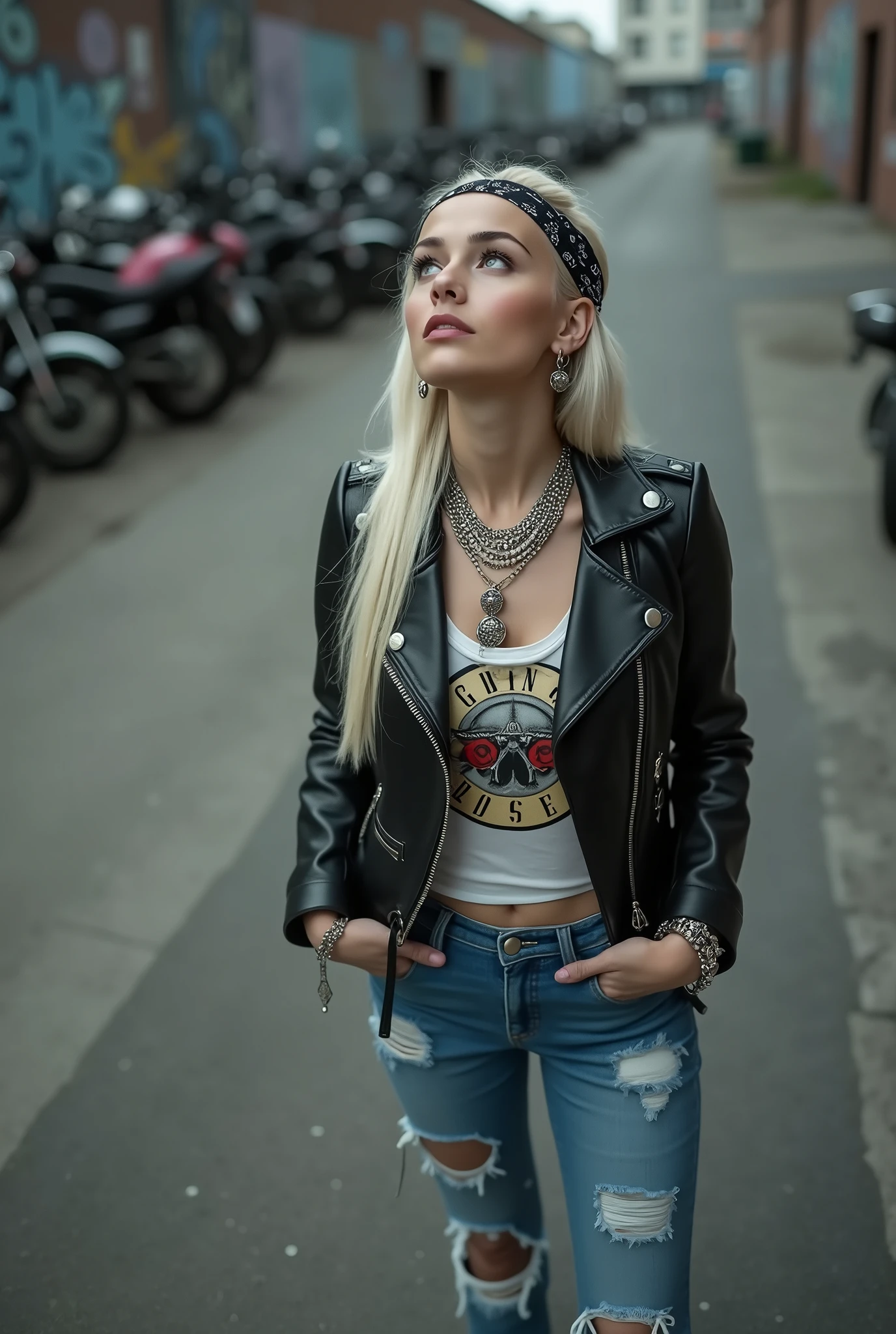 russian  woman, biker gang member, platinum blonde hair (straight, middle part) with bandana headband, with very light blue eyes, extremely pale. Thin legs and thin arms. Wearing cropped black moto jacket with lots of zippers and badges, raggy cropped t-shirt with guns and roses logo, skinny blue jeans with holes and silver chelsea boots with cuban heels. Lots of metallic bracelets and collars. Tacky leather belt with oversized, excessive silver buckle. Hands in pockets. Long earrings. Looks up, overwhelmed: she tinks God is speaking to her 