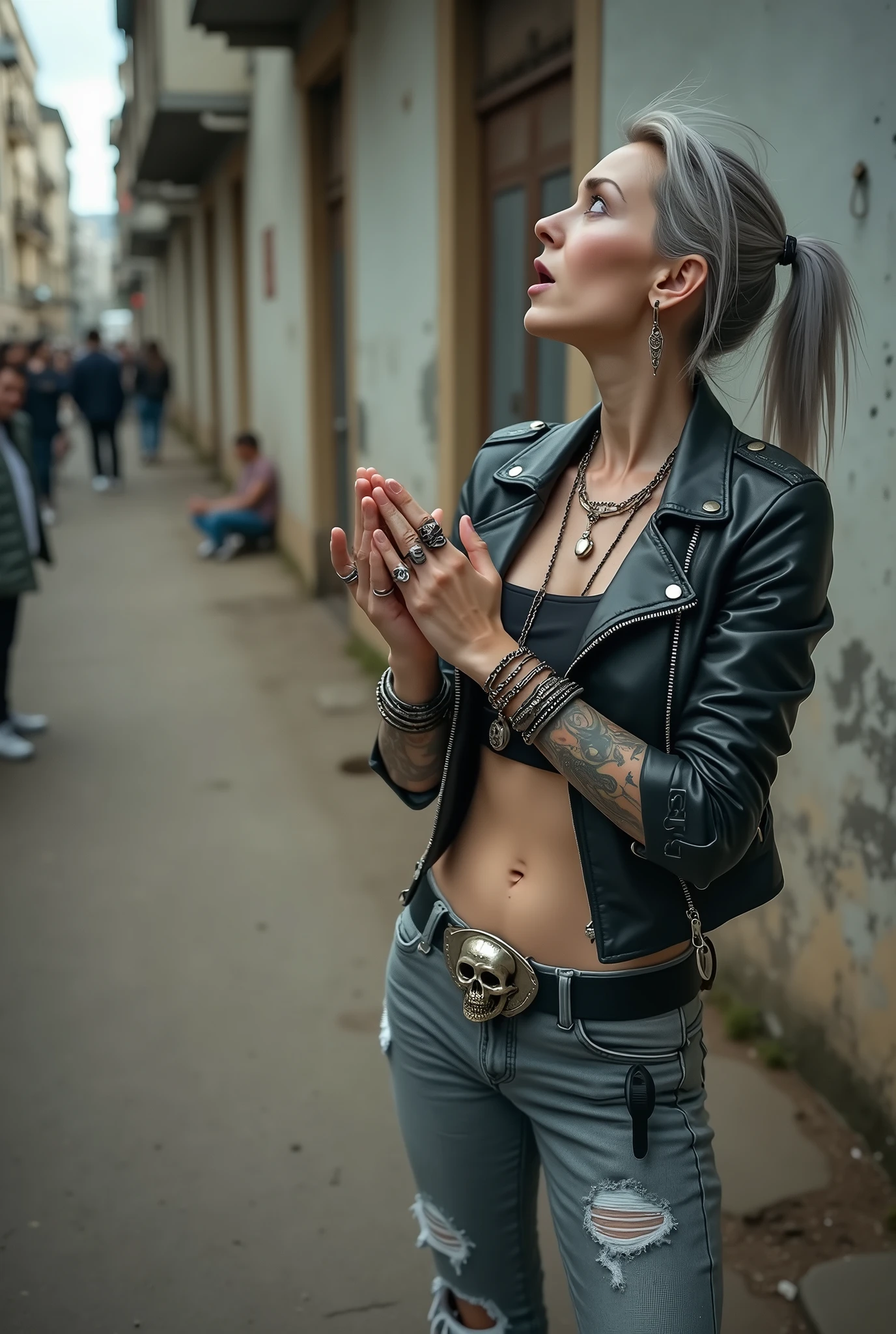 russian old milf woman, biker gang member, long grey hair (bump, quiff and ponytail) with very light blue eyes, extremely pale. Thin. Sad, humble face. Wearing cropped black moto jacket with side zippers, black cropped tank top with pentacle logo, skinny black jeans with holes and white tennis sneakers. Lots of metallic bracelets. Chains. Tacky wide belt with massive skull and bones buckle . Both hands in prayer. Demonic tattoos. Lots of rings. Long earrings. Looks up with amazement because she thinks God is talking to her, mouth and eyes open. Skinny legs, narrow hips. People around look at her