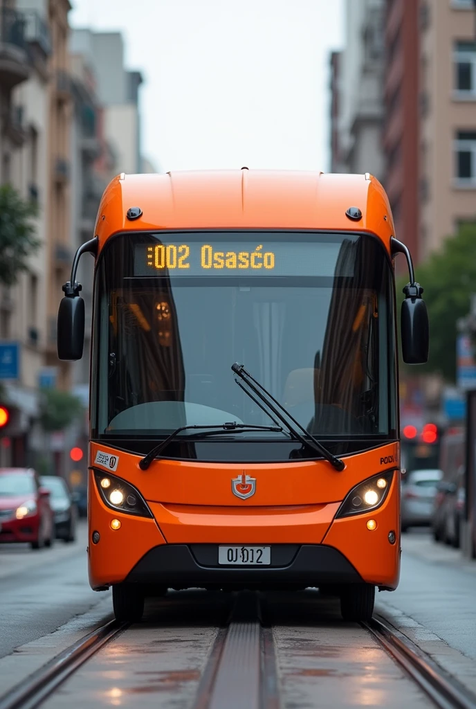 Orange Bus written on the sign: 002 Osasco