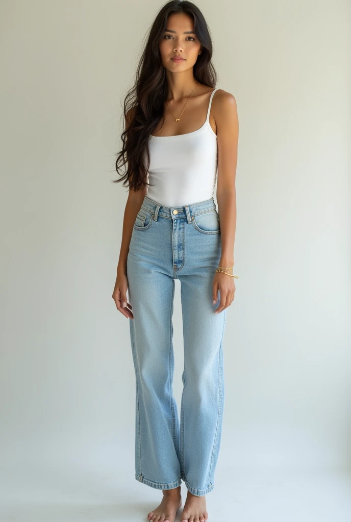 A woman wearing a white top pair with hi raise stove pipe jeans and a flat doll shoes 