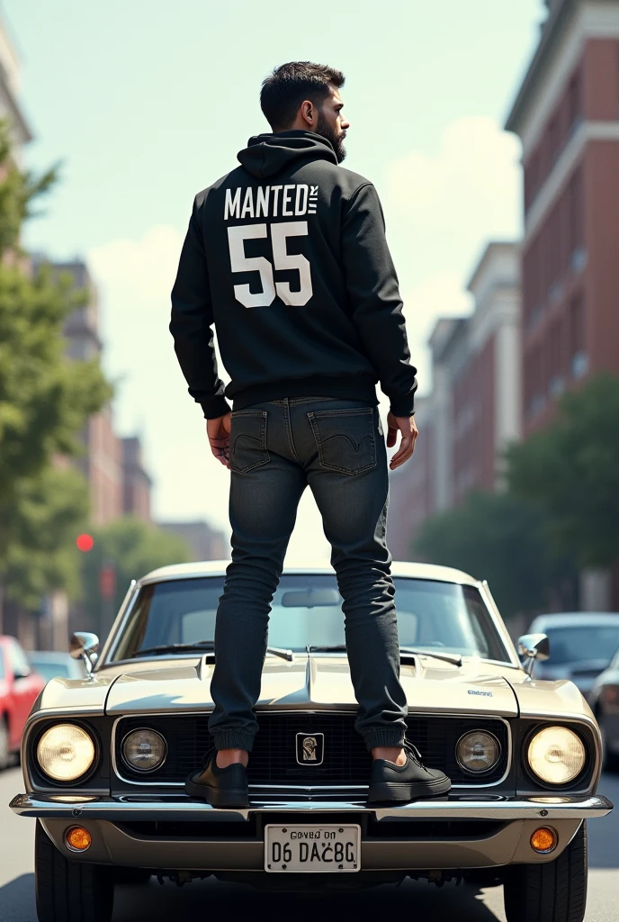 A man standing on top of his car with a name MANTED_55 printed on his back