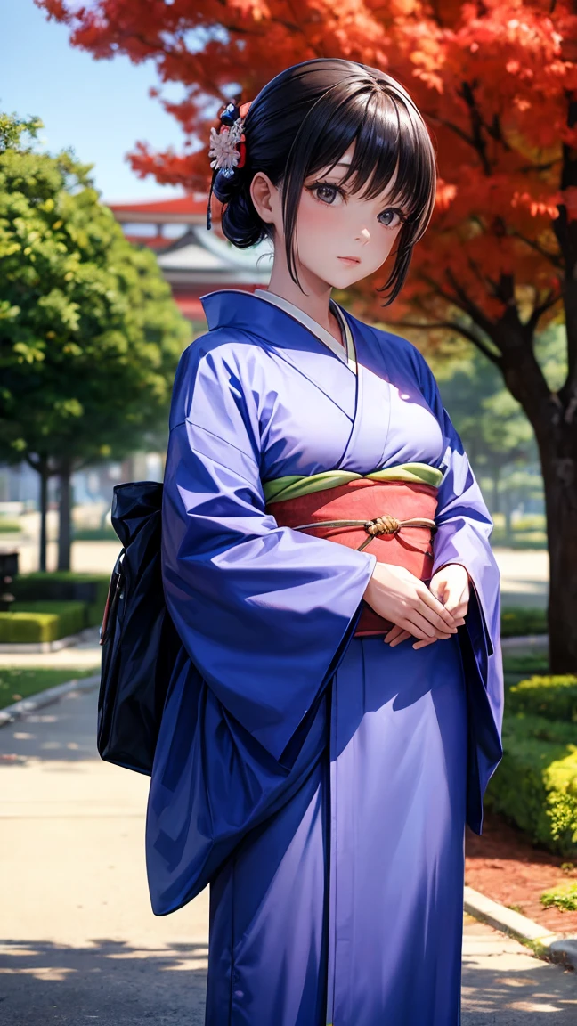 A woman in a kimono stands in front of a tree.