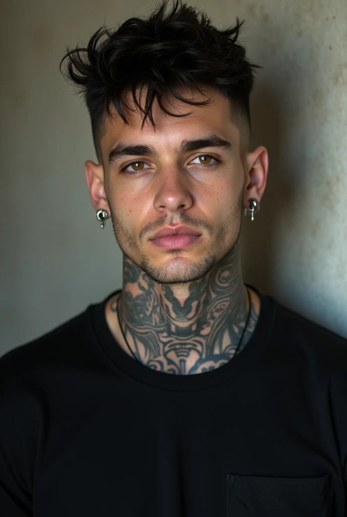 A man with short black hair, tunnels in the ears, tattoo on neck, in a black T-shirt
