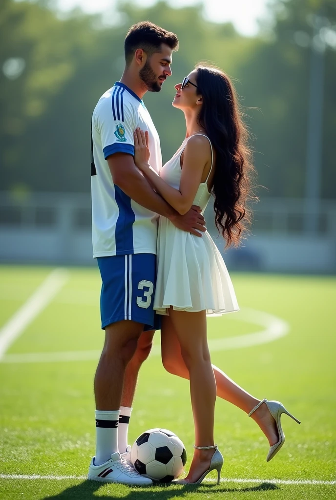  A woman and man standing in football ground looking at each lovingly and hugging each other.woman is wearing a dress and glasses.she has black hair .man is wearing a white and blue 32 number jersey. Man is 1 feet taller than girl.  Man one foot standing on soccer ball . Make girl wear high heel and white dress