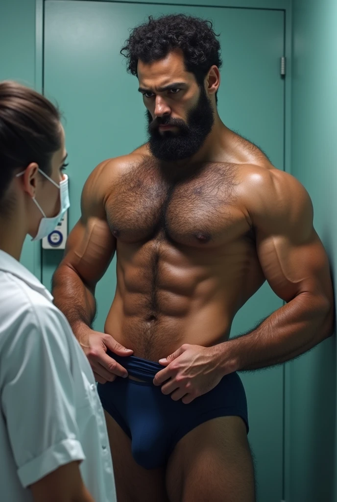 Strong, hairy, bearded mixed race man in navy blue underwear, taking off his underwear in front of a female doctor.