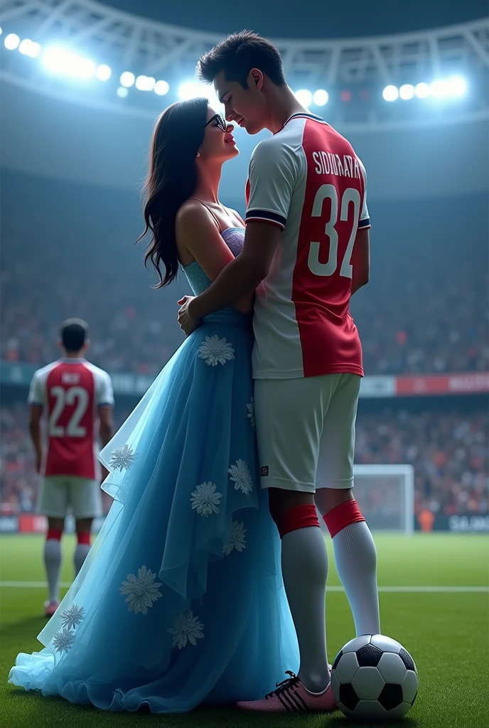 A man and woman kissing eachother in football stadium ground at night time all spot light on them woman is wearing glasses and had black hair . Woman is wearing long blue dress high heels . Man is wearing white and red colour 32 number jersey. Siddharth written on jersey. Woman is cupping man s face . Man s one foot resting on a soccer ball. Man is 1 feet taller than woman. Add some audiance in stedium . . Make it real .make boy handsome . Make dress long, floral and fluffy. . Man 2 feet taller than woman. Jersey number is 32. Add goal net in back ground . One man is back towards Siddharth and he is also wearing 22 number white and red jersey. Write neil on jersey