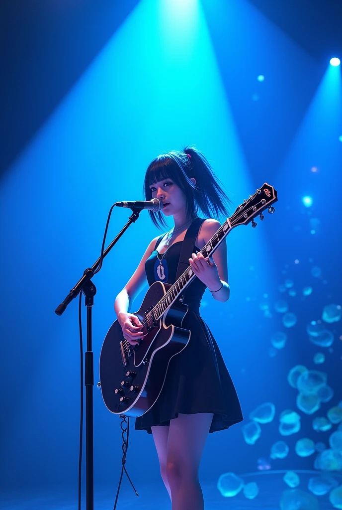 Blue musical stage with a girl playing the guitar with a microphone, Black hair with blue streaks and black dress with blue and white accents
