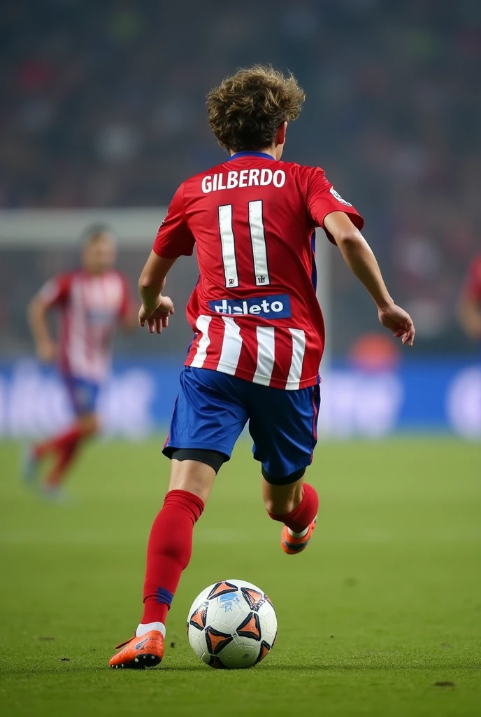 High quality photography, of a 19 year old boy playing football, running after a ball with his back turned, with the name Gilberto and the number 11 on his back, His hair is a little big, with the uniform of Atlético Madrid Realista,