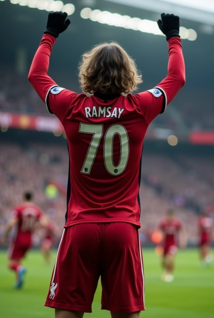 Liverpool player called Ramsay who wears number 70, long sleeves, black gloves and wavy hair celebrating like Messi seen from behind