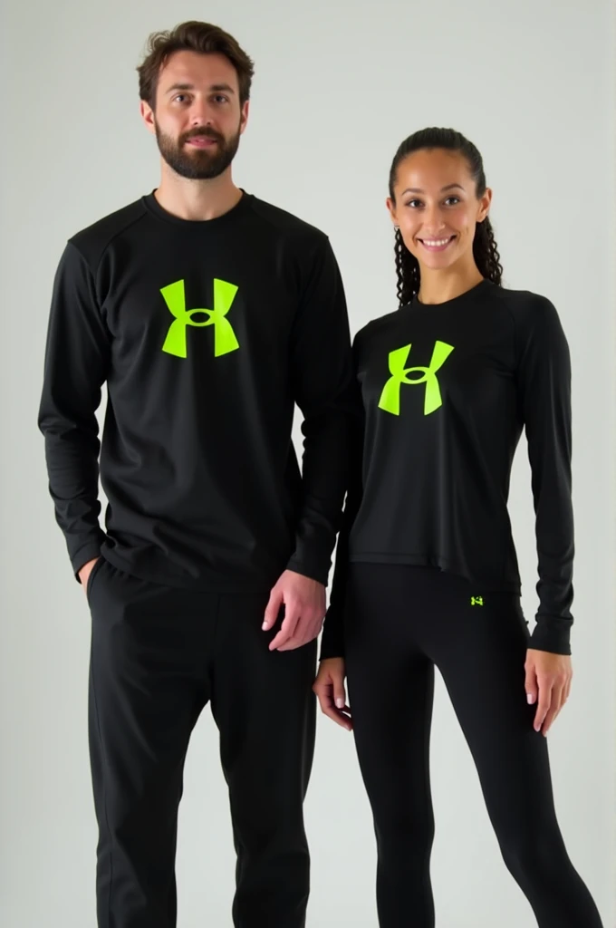 General image of a man and woman wearing black long-sleeved sports outfits and leggings with a lemon green H logo