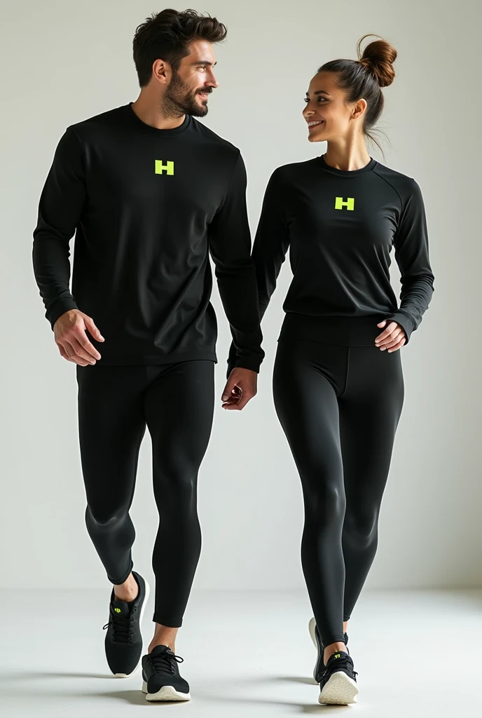 General image of a man and woman wearing black long-sleeved sports outfits and leggings with a lemon green H letter logo
