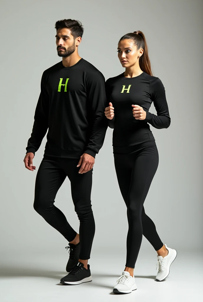 General image of a man and woman wearing black long-sleeved sports outfits and leggings with a lemon green H letter logo