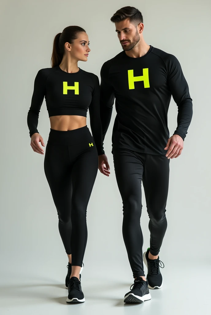General image of a man and woman wearing black long-sleeved sports outfits and leggings with a lemon green H letter logo