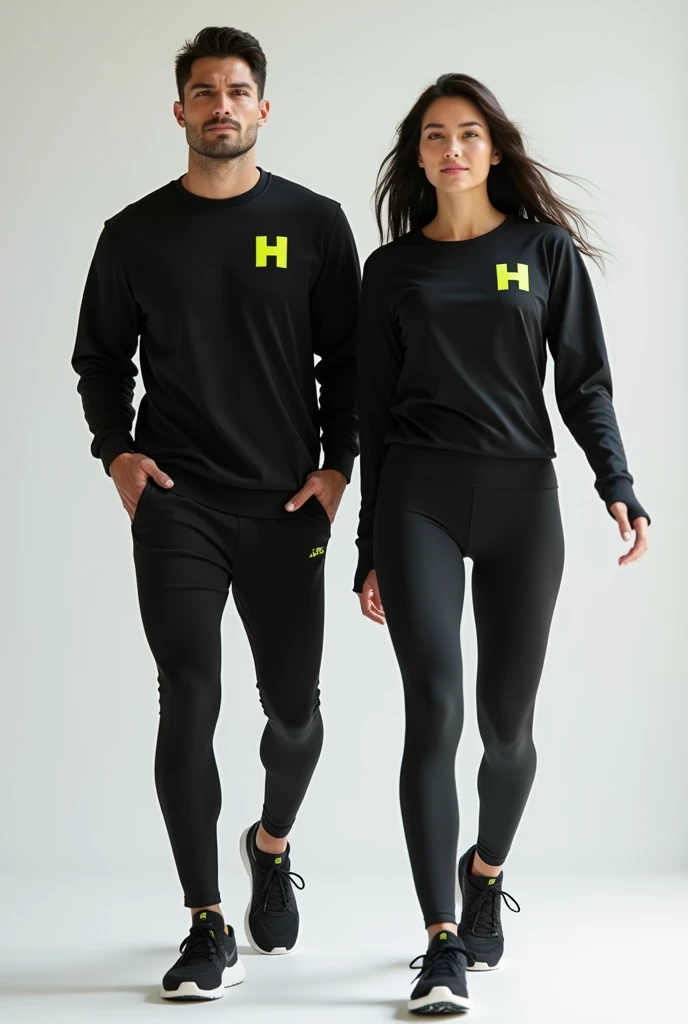 General image of a man and woman wearing black long-sleeved sports outfits and leggings with a lemon green H letter logo