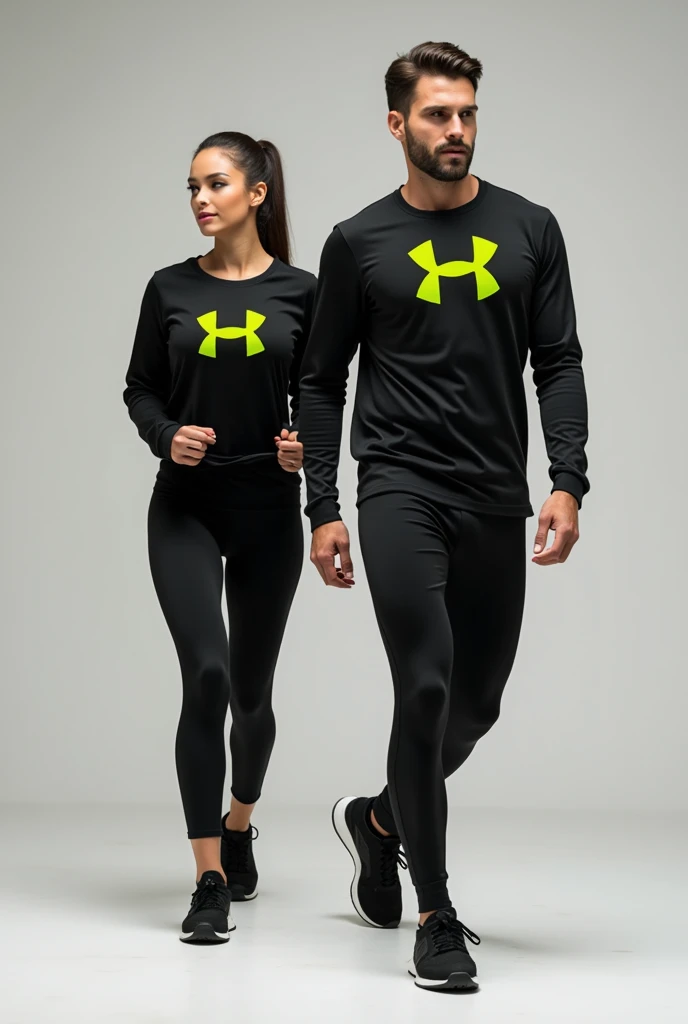 General image of a man and woman wearing black long-sleeved sports outfits and leggings with a lemon green H logo