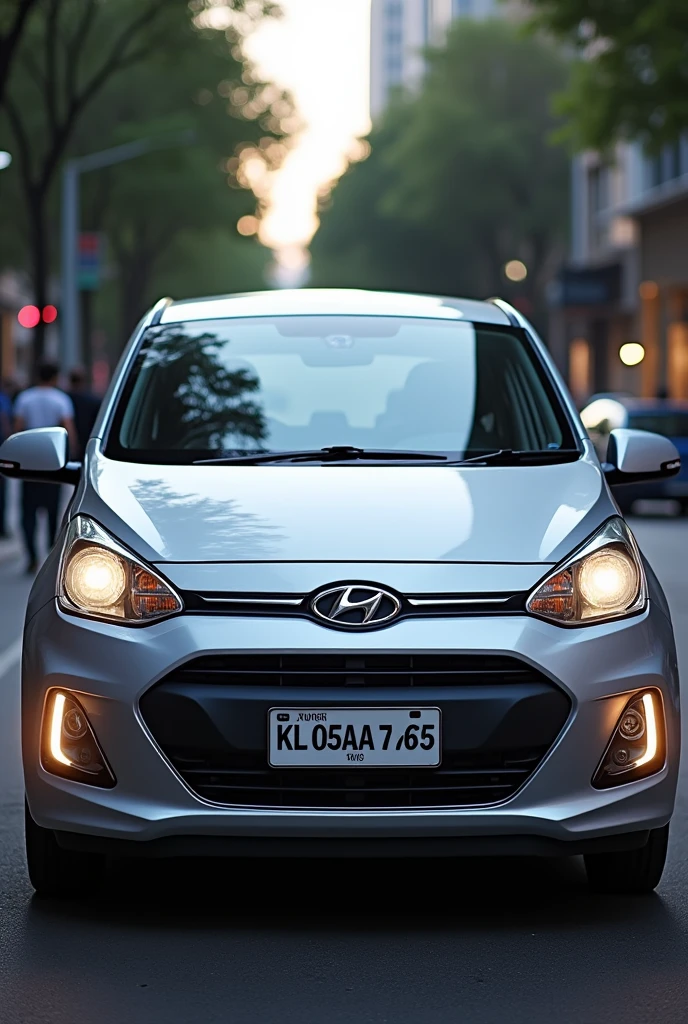 Hyundi i10 era silver color with registerd number KL05AA 7665 and name of Thyparampan