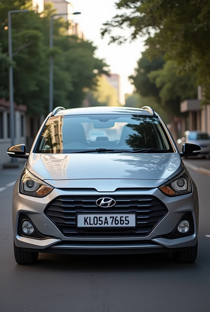 Hyundi i10 era silver color with registerd number KL05AA 76 65 and name of Thyparampan