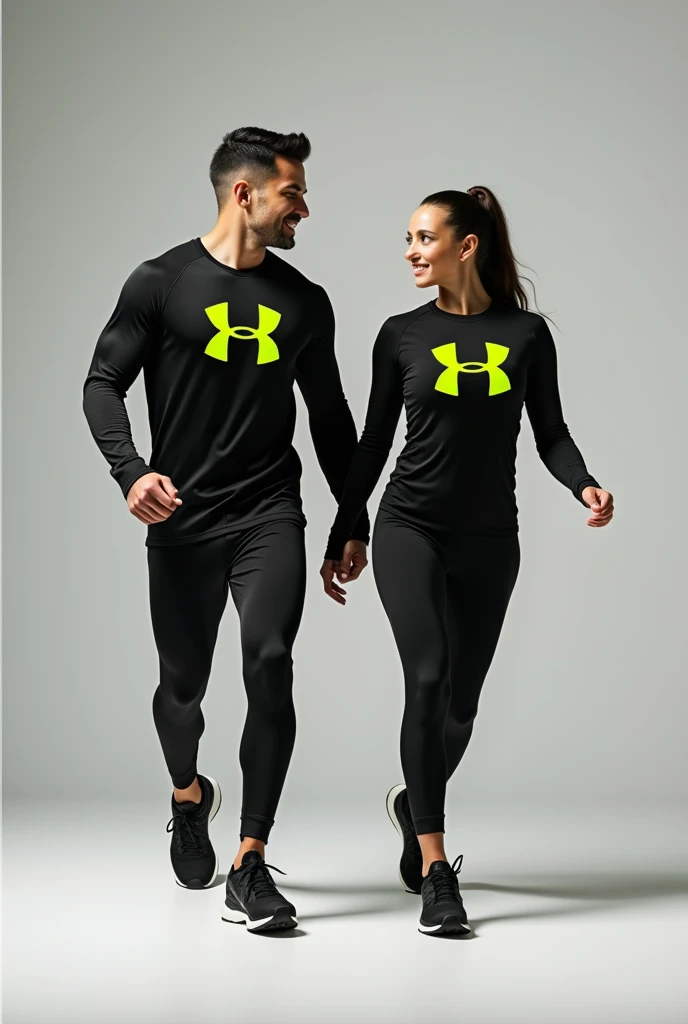 General image of a man and woman wearing black long-sleeved sports outfits and leggings with a lemon green H letter logo