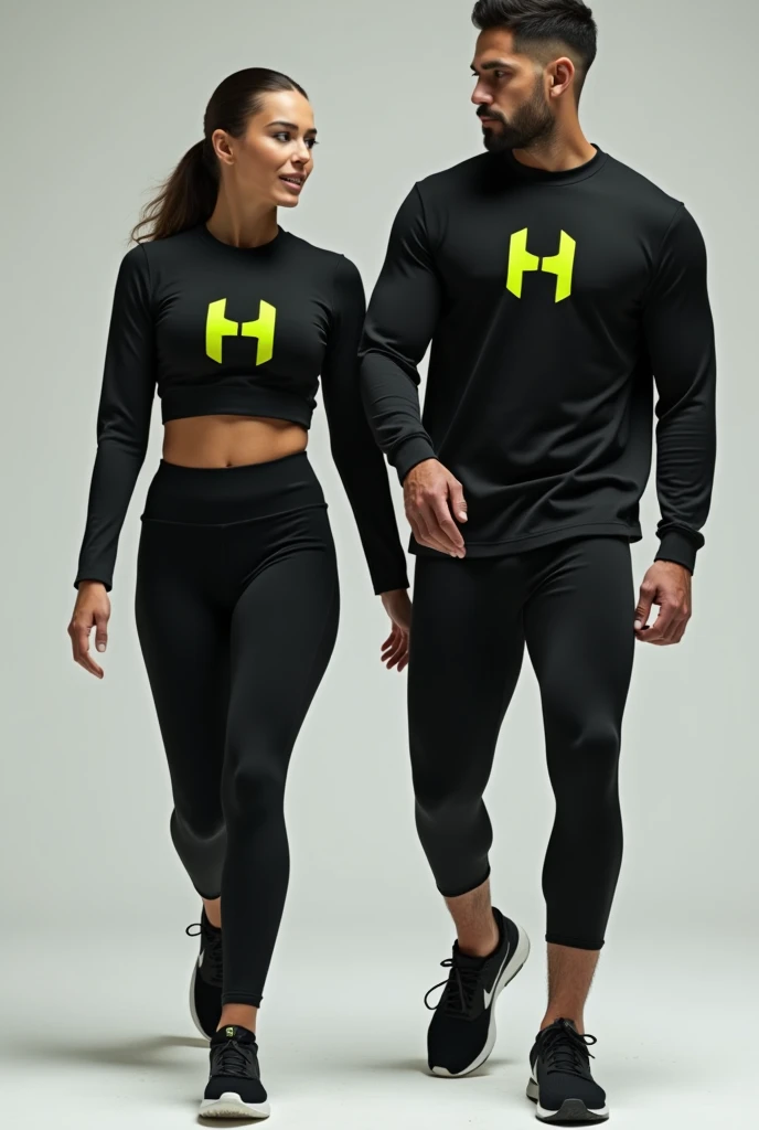 General image of a man and woman wearing black long-sleeved sports outfits and leggings with a lemon green H letter logo