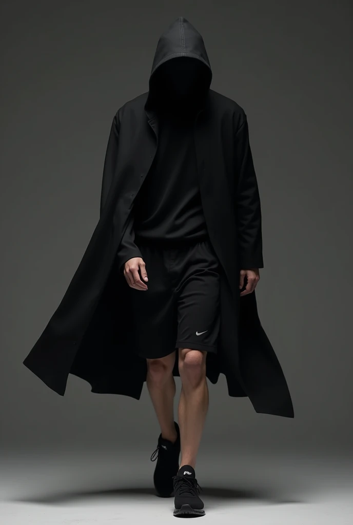 A man wearing a black cap and robe and black shorts Nike sneakers