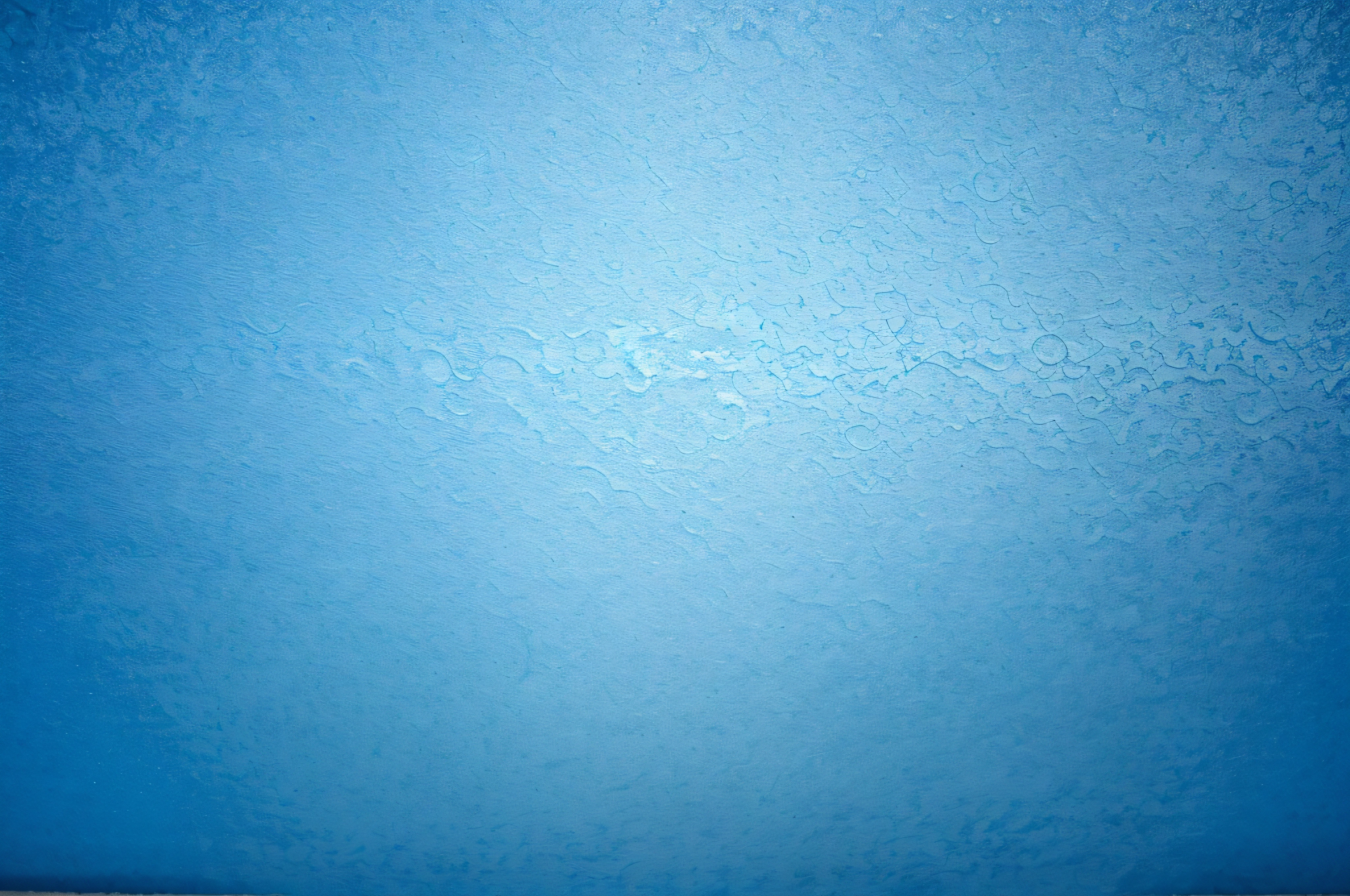 texture of bright blue paper as background