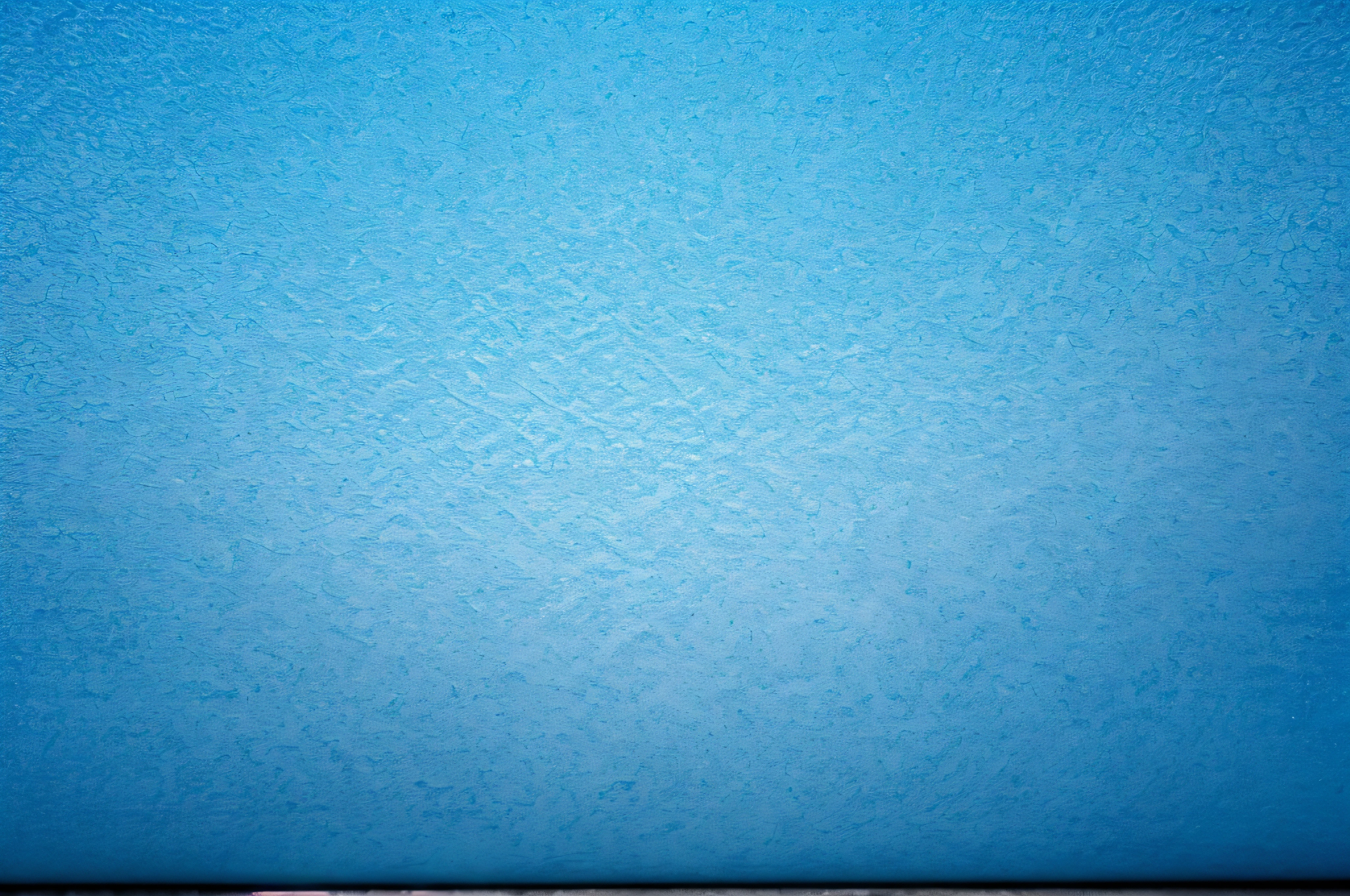 texture of bright blue paper as background