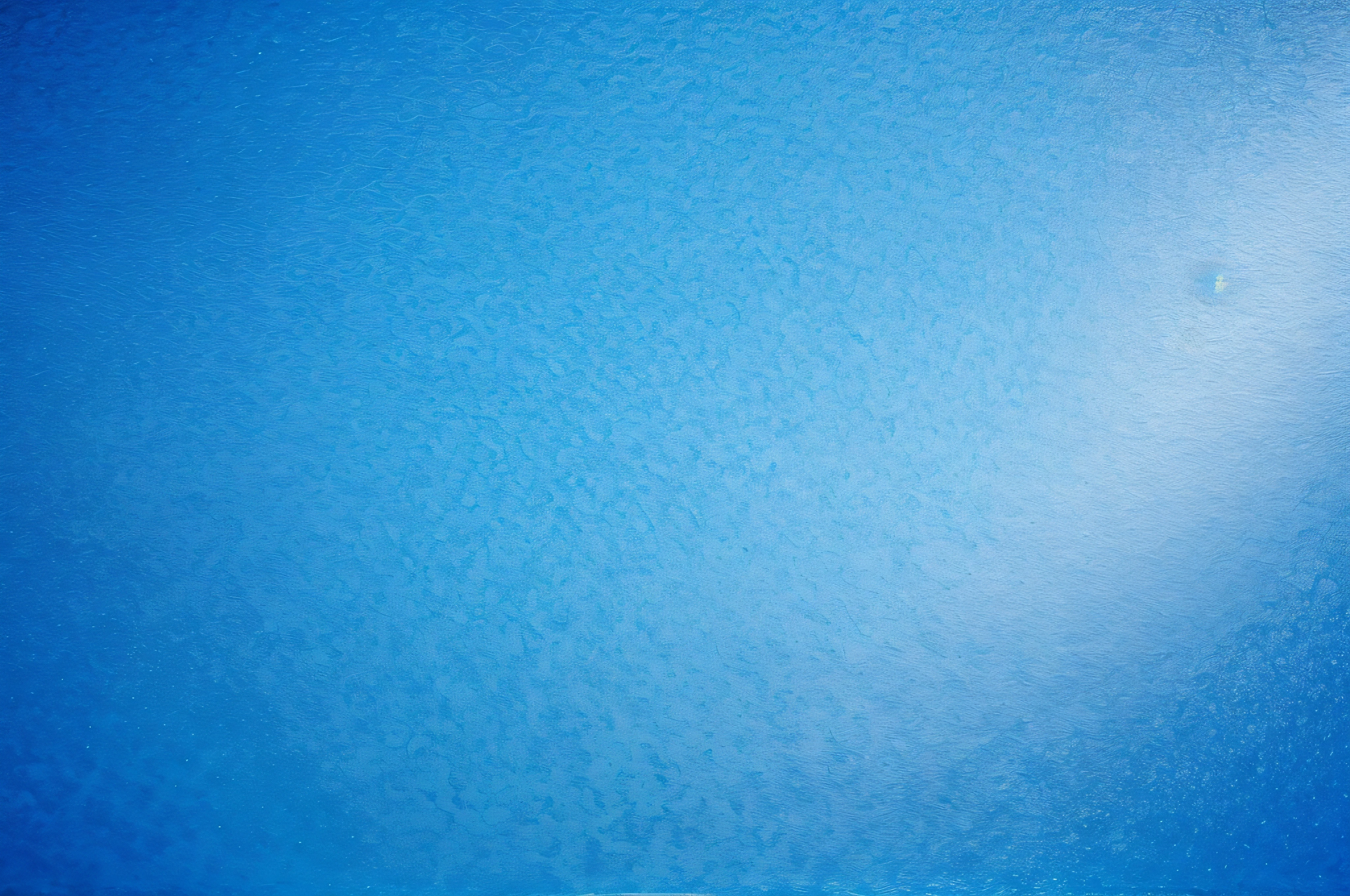 texture of bright blue paper as background