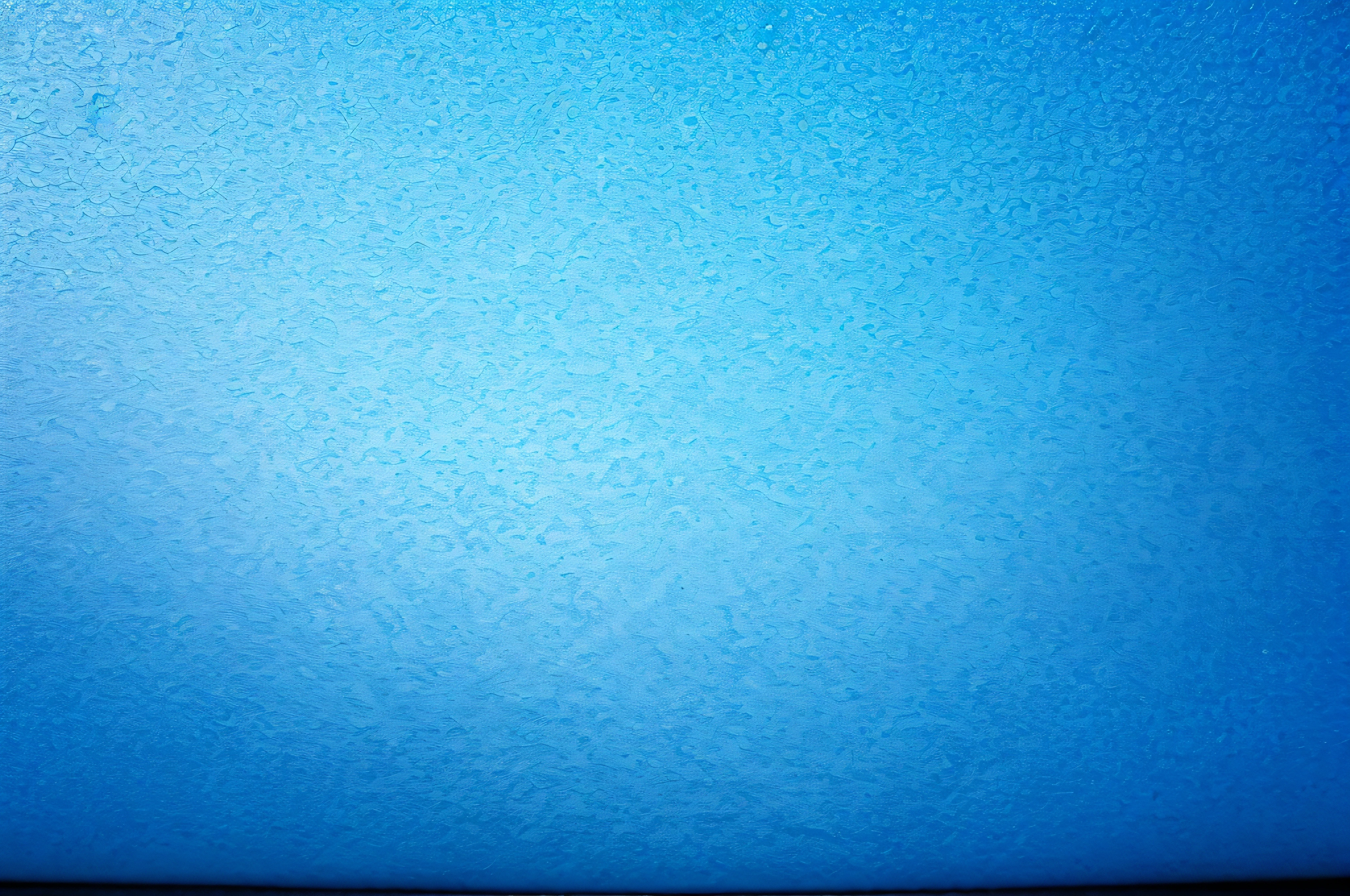 texture of bright blue paper as background