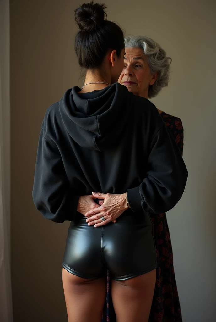 black woman hair in a bun black hoodie black leather short shorts being fucked in the ass by a old grandma in a dress standing behind her