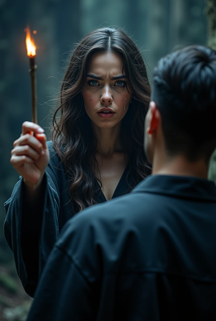 A woman with wavy dark brown hair and blue eyes pointing her wand at a man from behind, she is crying.