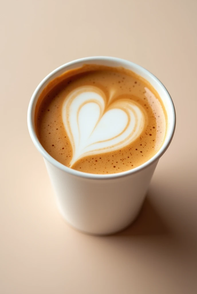 A latte heart coffee shot from a top angle, zoomed in, with milk, in a white cup plastic dunkin donut
