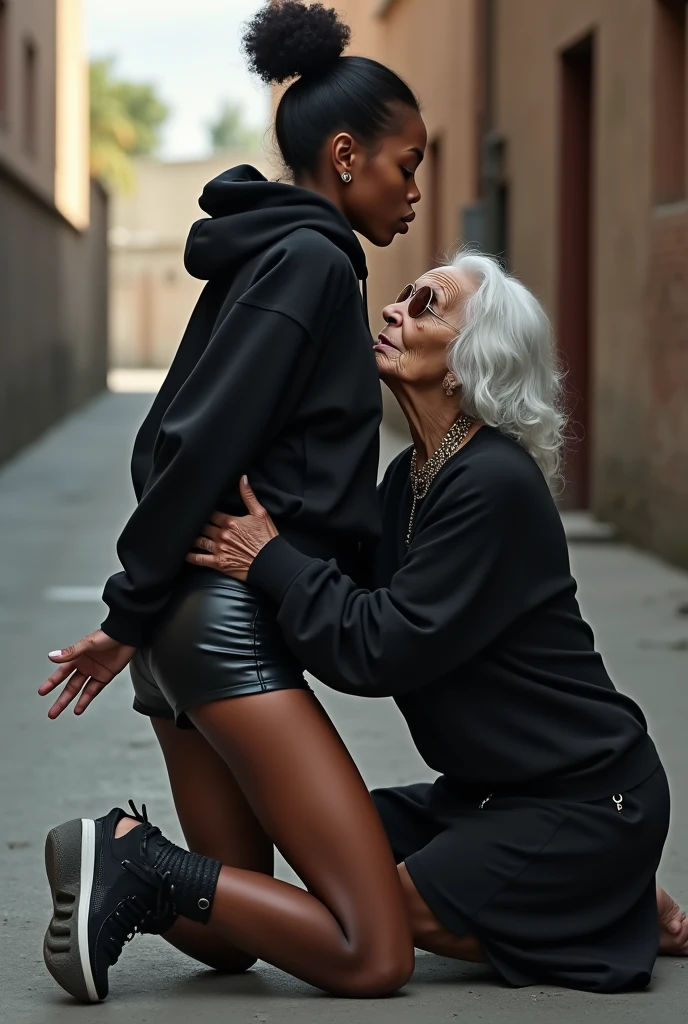 black woman hair in a bun black hoodie   black leather short shorts   a old grandma in a dress on her knees kissing her ass behind her squeezing her butt