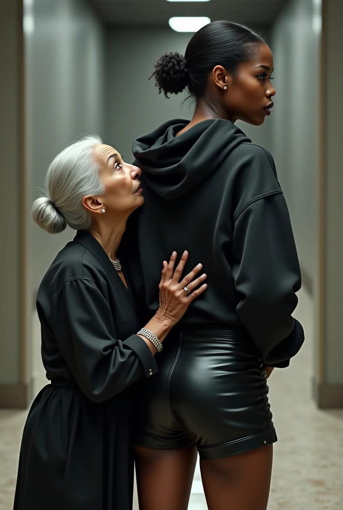 black woman hair in a bun black hoodie black leather short shorts a old grandma in a dress on her knees kissing her ass behind her squeezing her butt