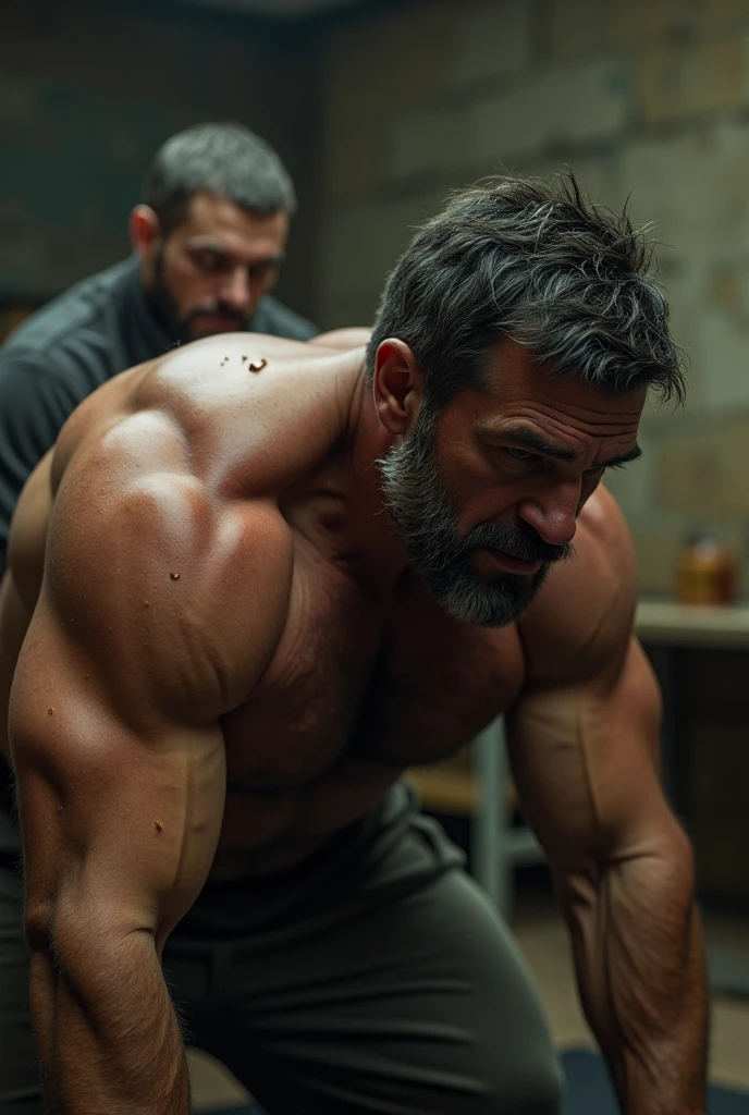 40-year-old fit, hairy man forced to do push-ups until exhaustion with a clothed person sitting on his back, seen from the side and half way up
