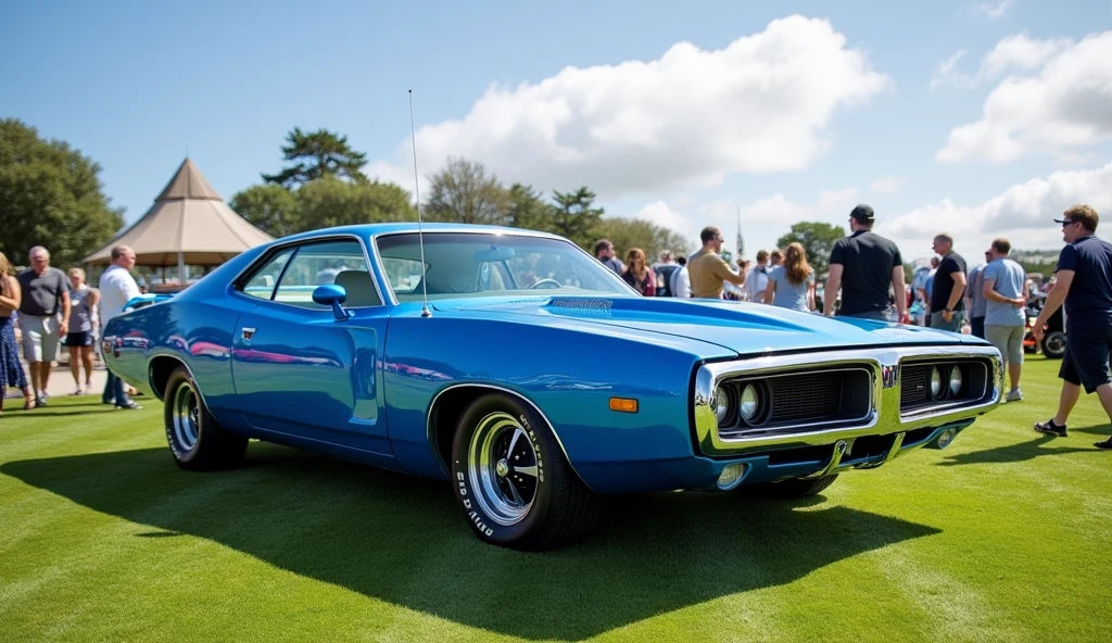 73 valiant charger electric blue at the Goodwood festival  with a sunny day, wispy white clouds