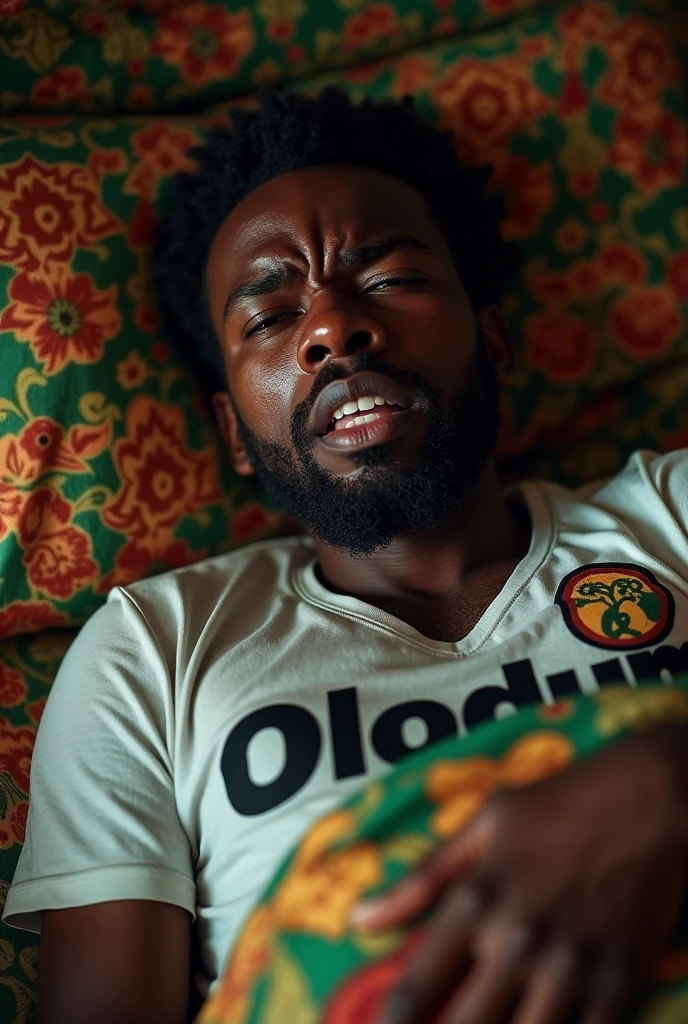 Bahian man crying with Olodum t-shirt lying on the olodum bed