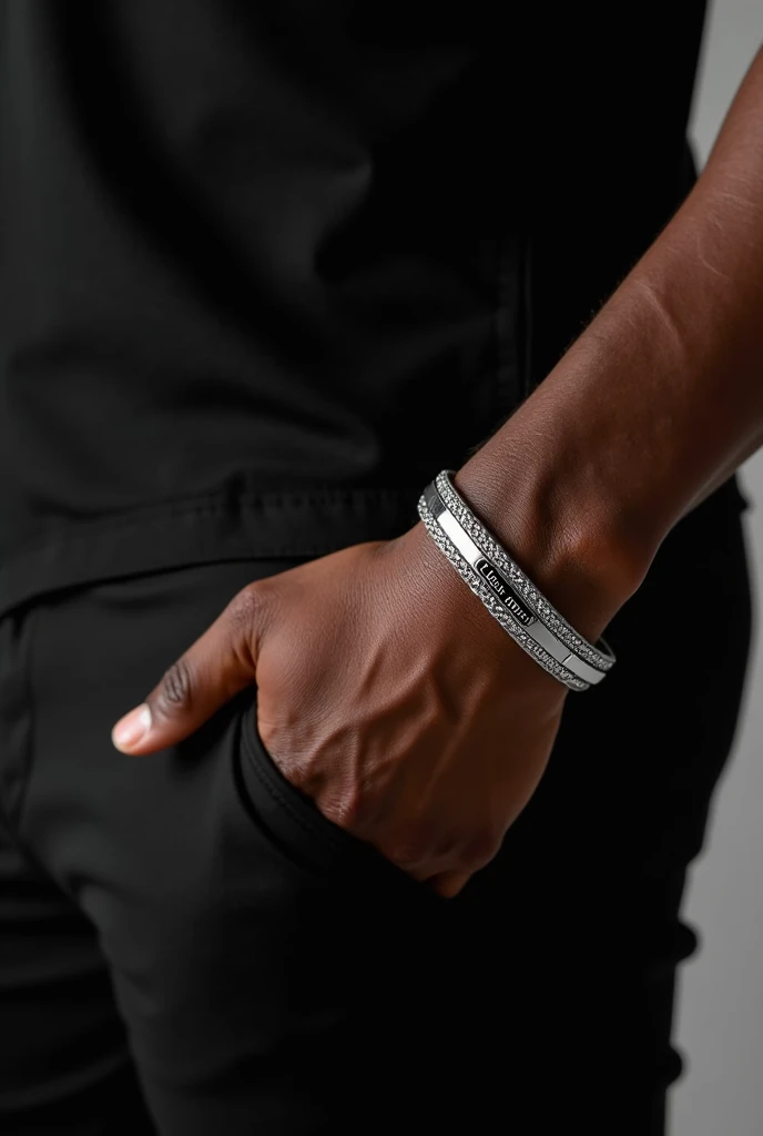 Jewelry bracelets men&#39;s bracelet, Plata, braided rhinestones on the edges, written in the center Clayton Du Lord The model is of black ethnicity and wears a black shirt