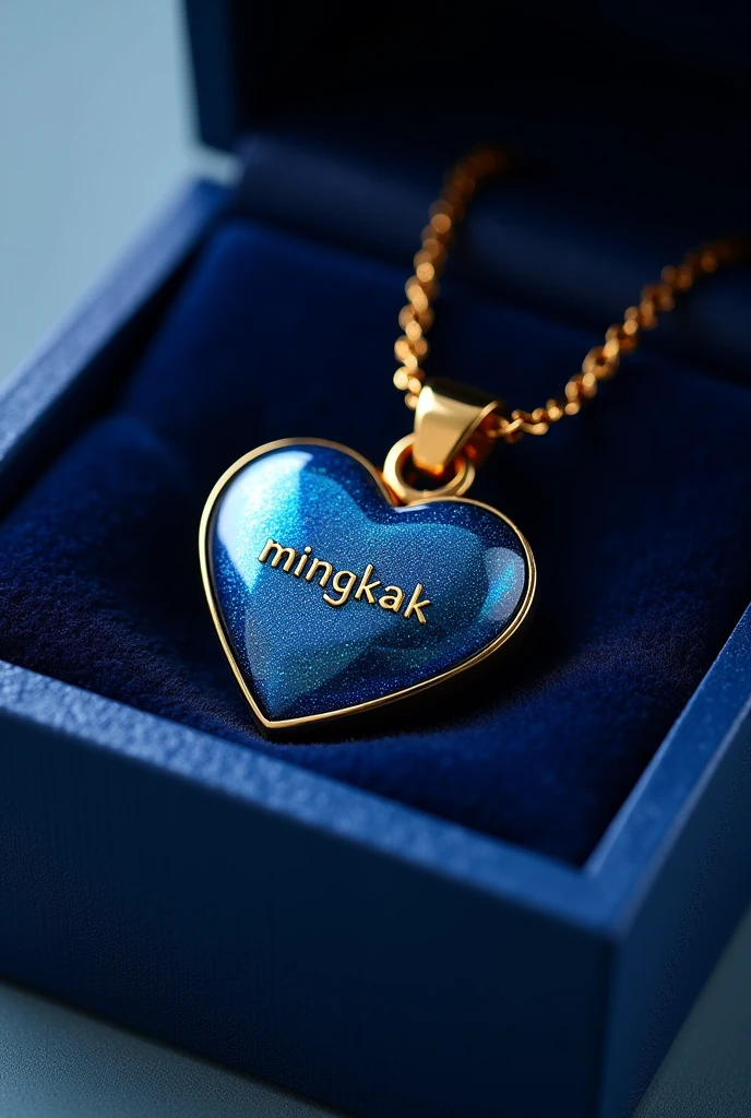 Create a shiny and sparkling dark blue heart-shaped pendant image with a shiny gold plating., personalized with name "MINGKAK" engraved in the middle. The pendant is attached to a simple and elegant loop and is presented in a navy blue open gift box with a glossy textured bright blue exterior and a plush interior that matches the color of the box..

3)