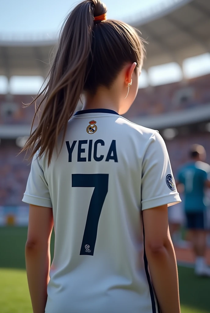 A girl with her back turned wearing a Rela Madrid shirt that says Yeica, a white shirt with the number 7