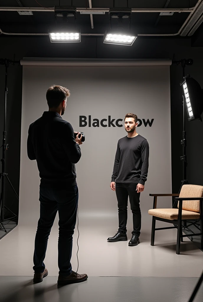  Photographic studio with  1 man in it doing a photoshoot  to a client. studios name is blackcrow in blackletter  