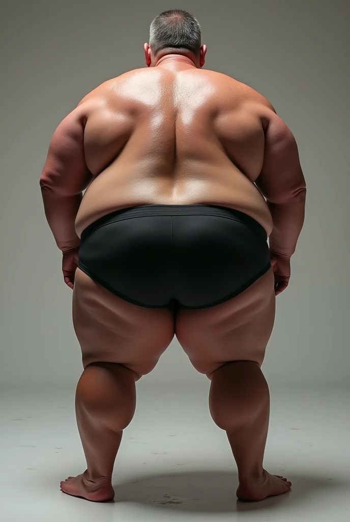 Middle-aged man, in the four position, seen from behind, shirtless, with two large, pompous, very well-defined and somewhat fat buttocks, with a black boxer short, with long stockings that reach the end of her thighs, with a sweaty body.